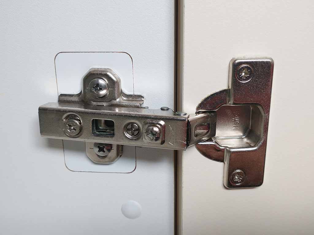 Cabinet hinge tear-out repair.